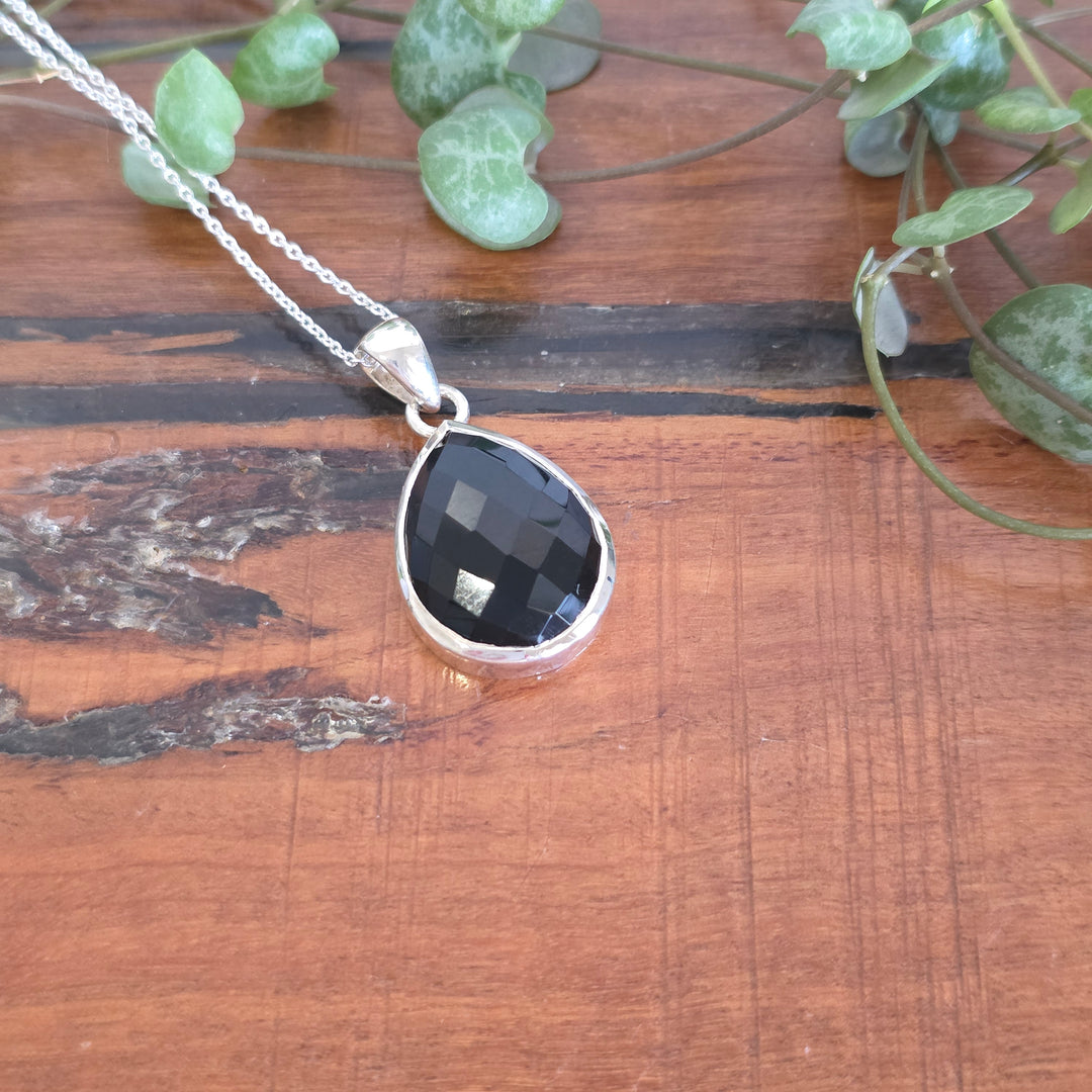 A black onyx pendant set in 925 sterling silver.