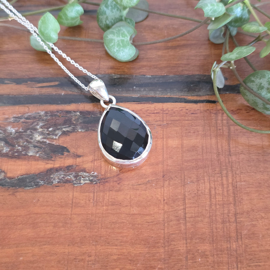 A black onyx pendant set in 925 sterling silver.