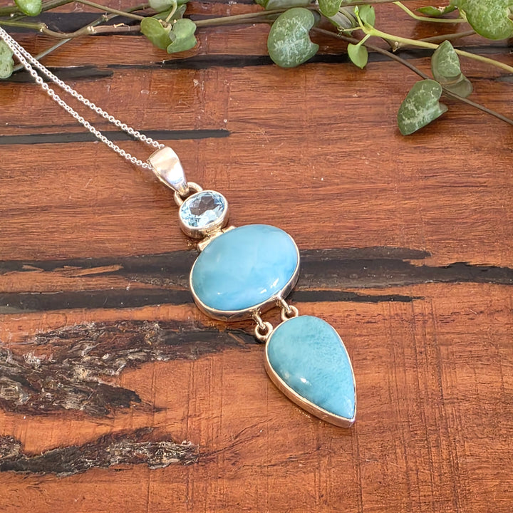 Larimar & Blue Topaz Pendant set in 925 Sterling Silver.
Comes with 40cm Sterling Silver Chain.