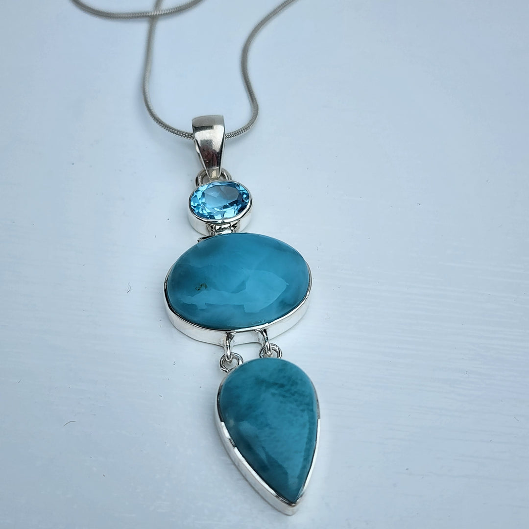 Larimar & Blue Topaz Pendant set in 925 Sterling Silver.
Comes with 40cm Sterling Silver Chain.