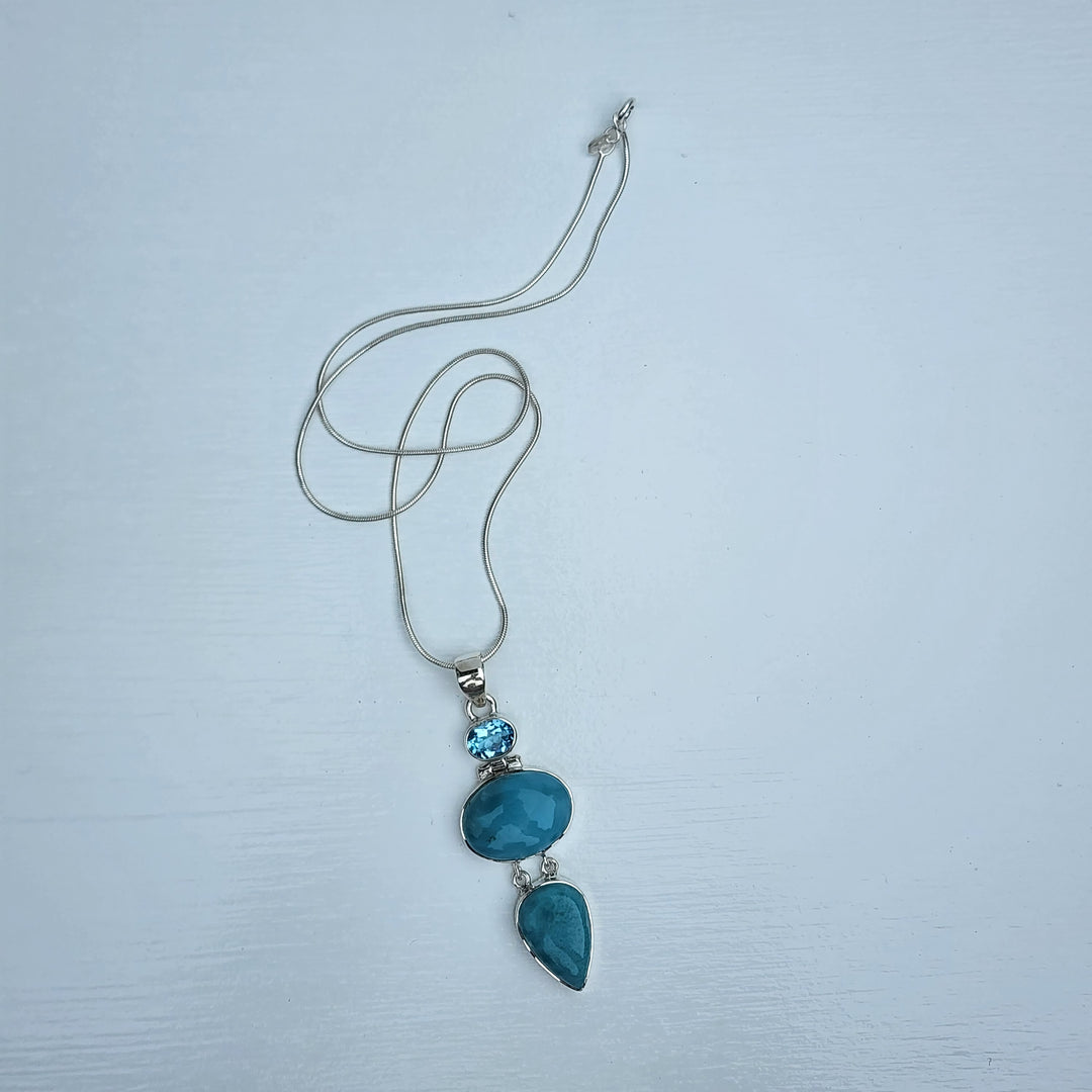 Larimar & Blue Topaz Pendant set in 925 Sterling Silver.
Comes with 40cm Sterling Silver Chain.