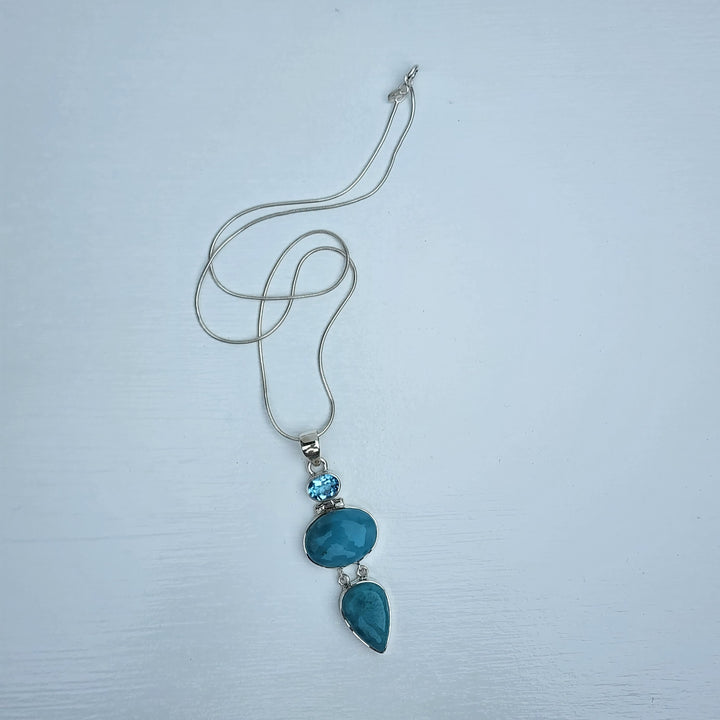 Larimar & Blue Topaz Pendant set in 925 Sterling Silver.
Comes with 40cm Sterling Silver Chain.