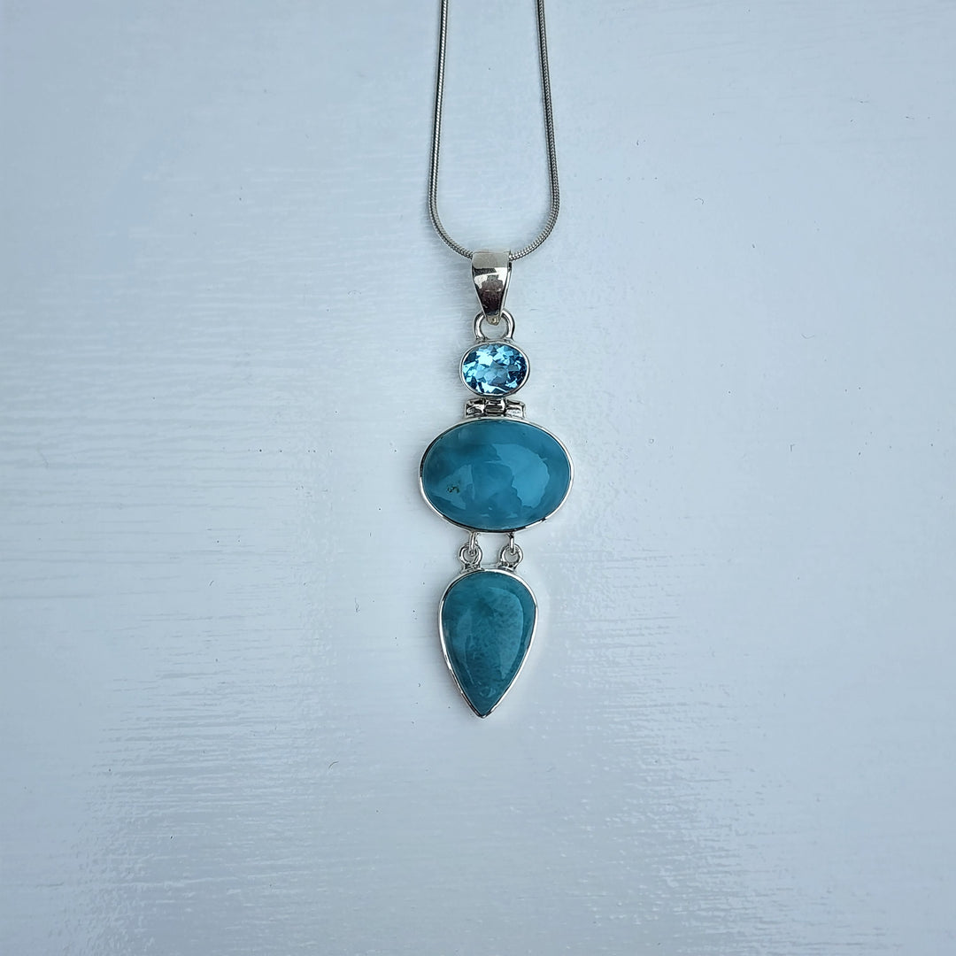 Larimar & Blue Topaz Pendant set in 925 Sterling Silver.
Comes with 40cm Sterling Silver Chain.
