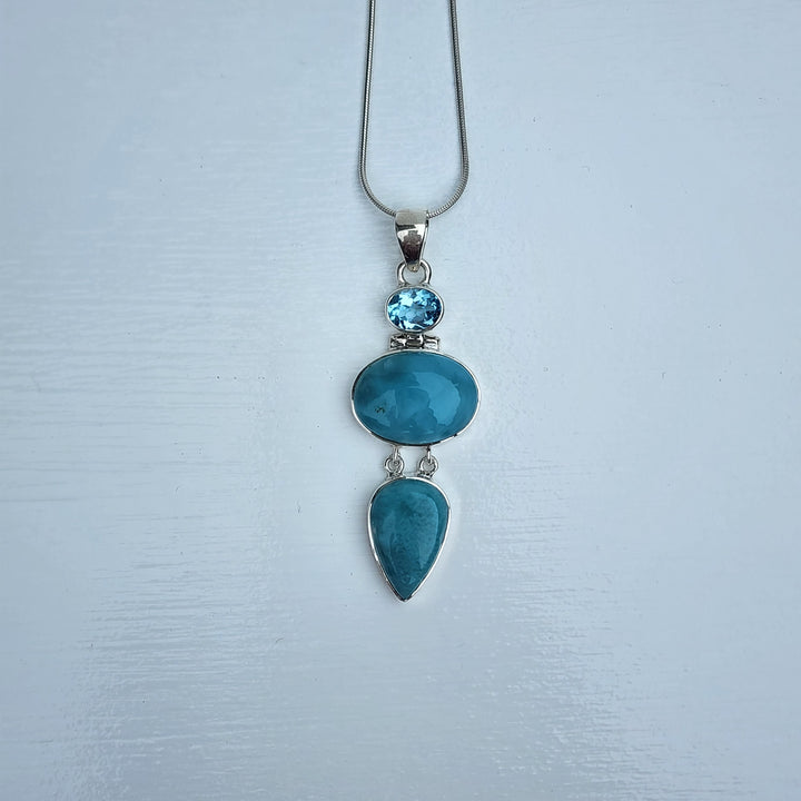 Larimar & Blue Topaz Pendant set in 925 Sterling Silver.
Comes with 40cm Sterling Silver Chain.