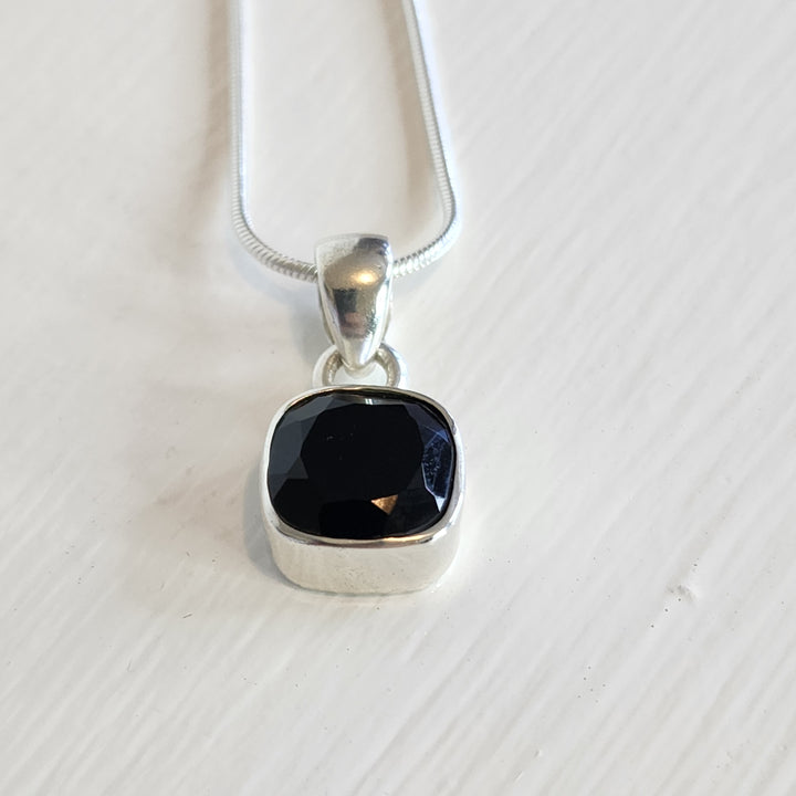 Back Onyx Pendant set in 925 sterling silver.