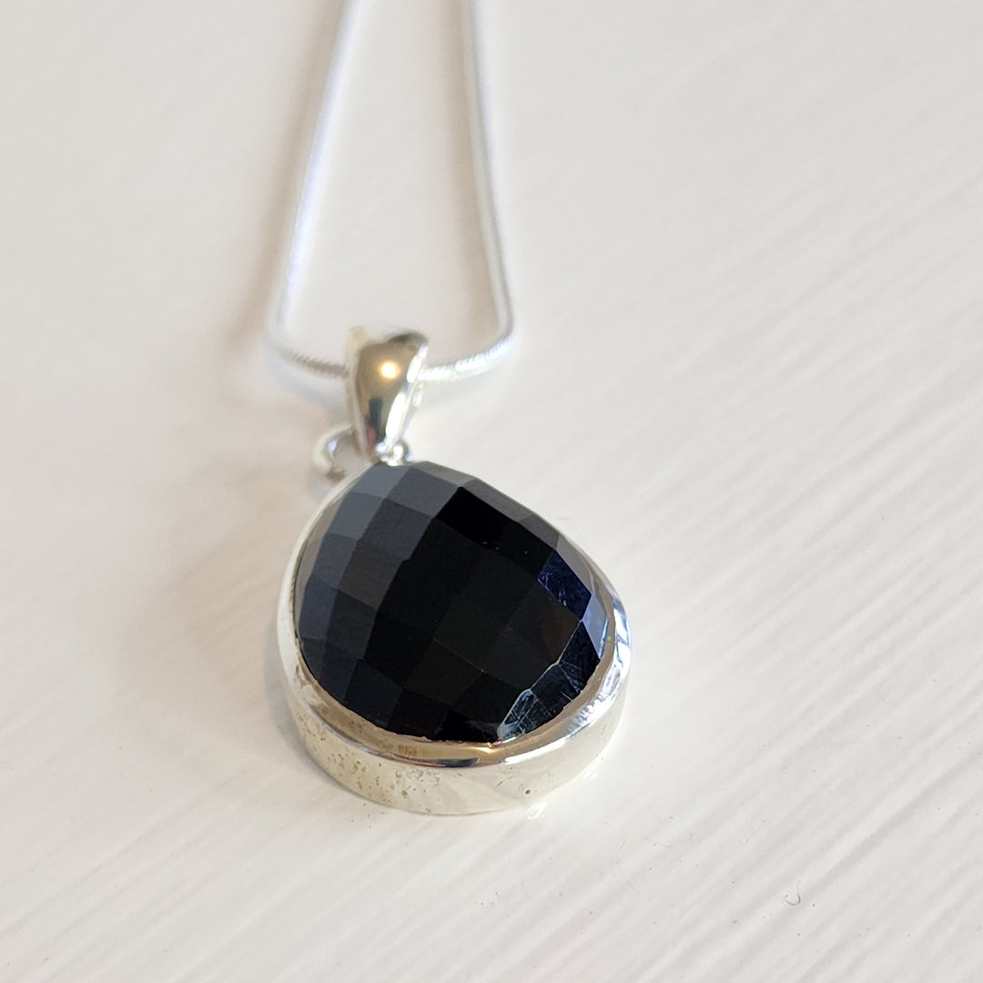 A black onyx pendant set in 925 sterling silver.