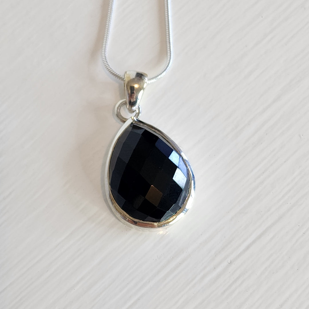 A black onyx pendant set in 925 sterling silver.