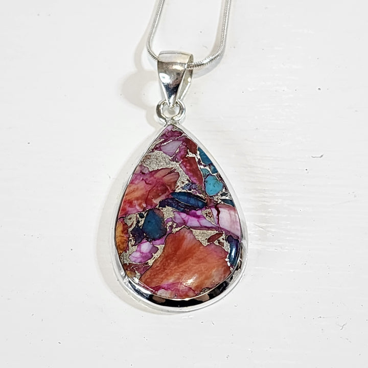Pink Oyster Turquoise Pendant Set in 925 Sterling Silver.
Comes with a 45cm Sterling Silver Chain.