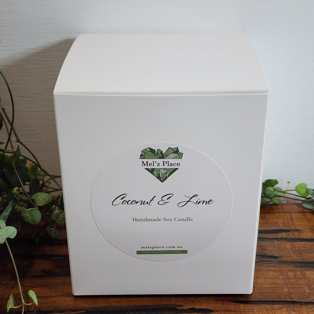 Soy Candle Box in white with Mel'z Place logo. Scent is coconut and lime.