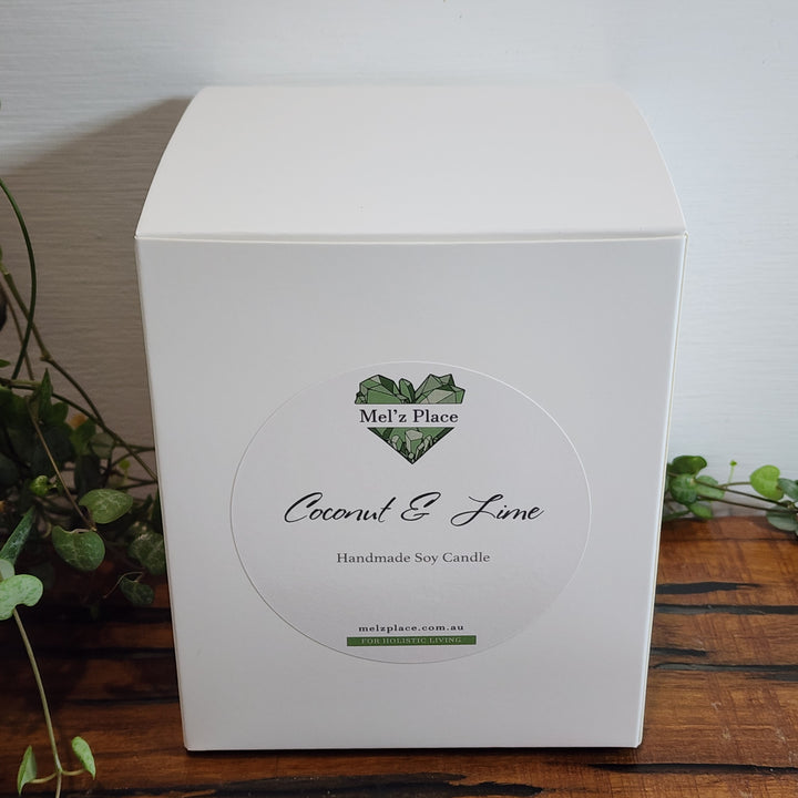 Soy Candle Box in white with Mel'z Place logo. Scent is coconut and lime.