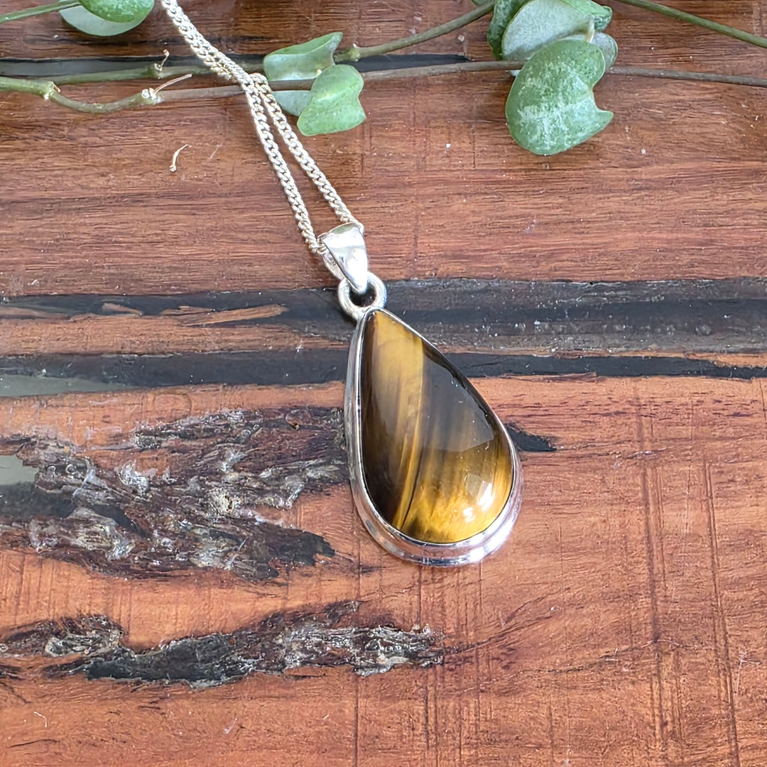 Tiger Eye Pendant set in 925 Sterling Silver, come with a 925 Sterling Silver Chain.