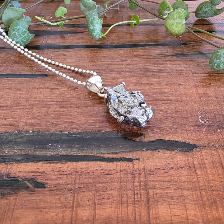 Meteorite Pendant set in 925 Sterling Silver.
Comes with 925 Sterling Silver 45cm Chain