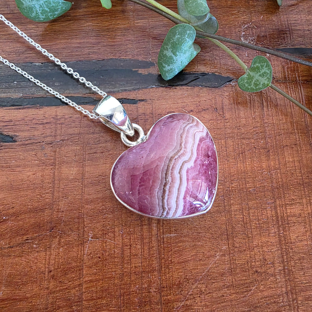 Rhodochrosite 21mm Heart Pendant.
Set in 925 Sterling Silver and comes with a 925 sterling silver chain.