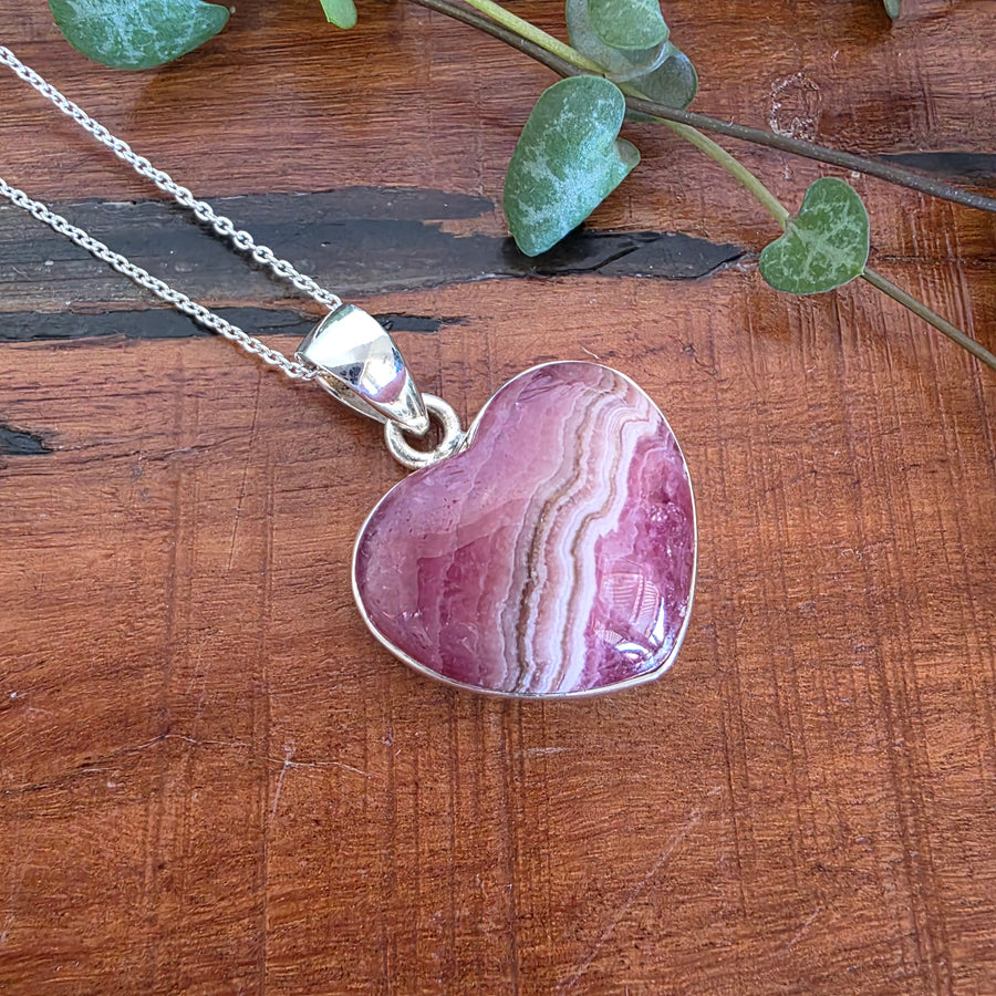 Rhodochrosite 21mm Heart Pendant.
Set in 925 Sterling Silver and comes with a 925 sterling silver chain.