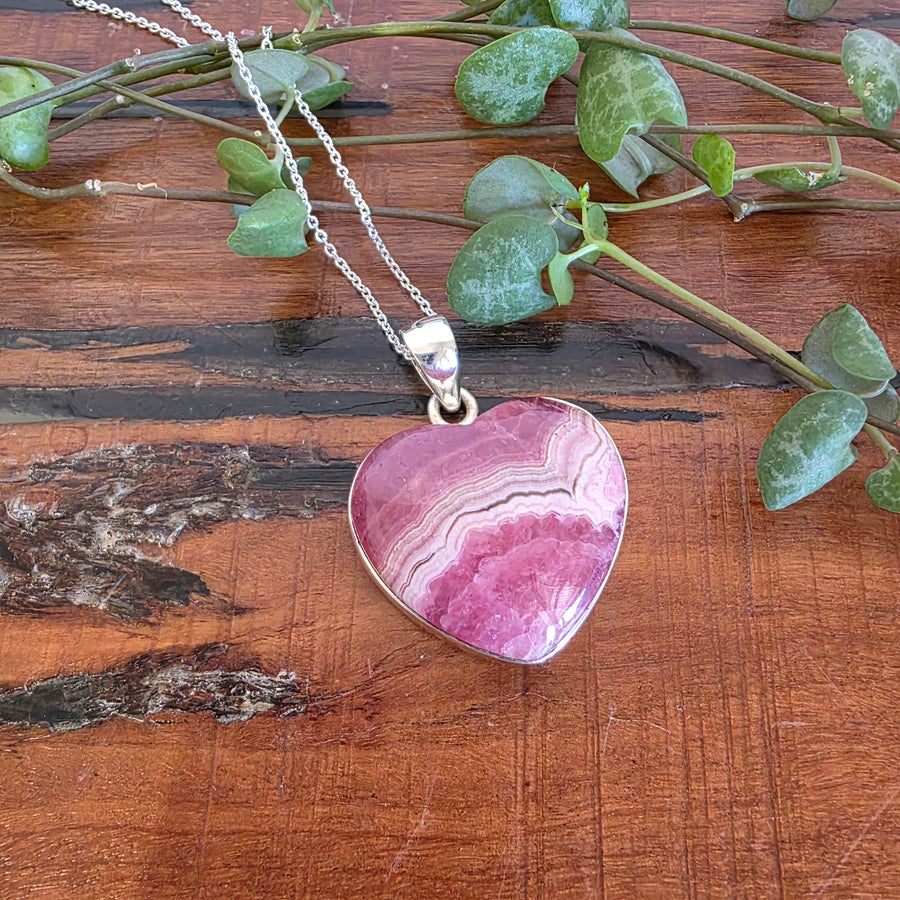Rhodochrosite 21mm Heart Pendant.
Set in 925 Sterling Silver and comes with a 925 sterling silver chain.