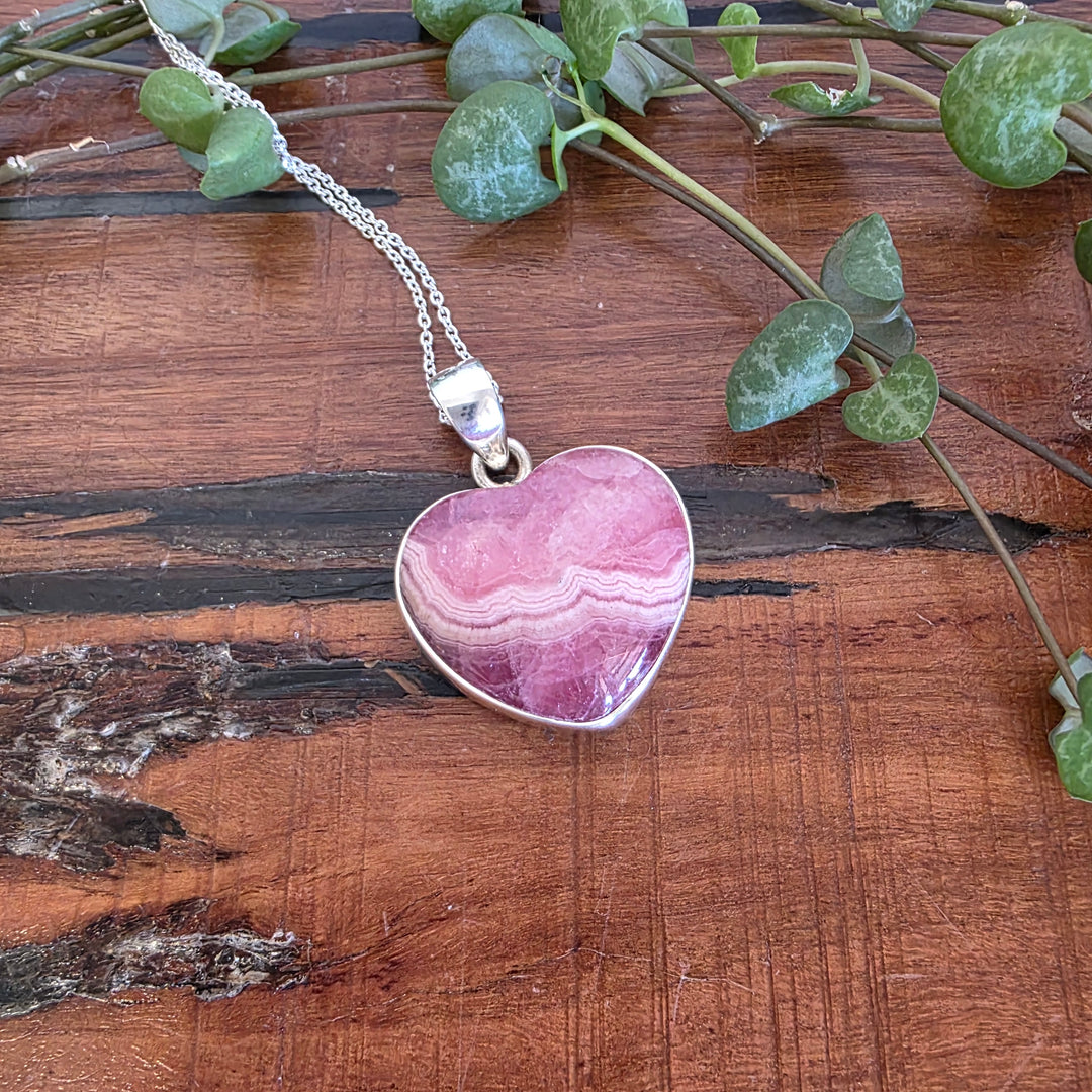 Rhodochrosite 21mm Heart Pendant.
Set in 925 Sterling Silver and comes with a 925 sterling silver chain.