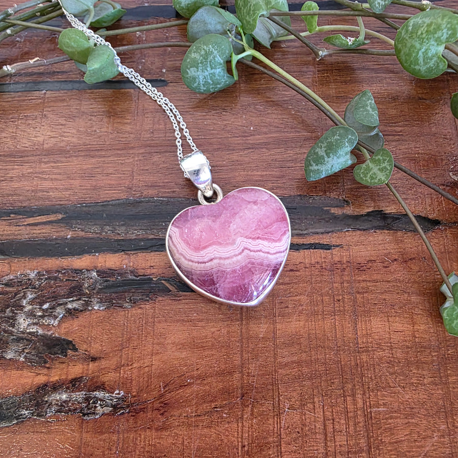 Rhodochrosite 21mm Heart Pendant.
Set in 925 Sterling Silver and comes with a 925 sterling silver chain.