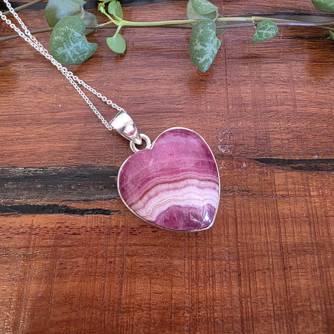Rhodochrosite 21mm Heart Pendant.
Set in 925 Sterling Silver and comes with a 925 sterling silver chain.