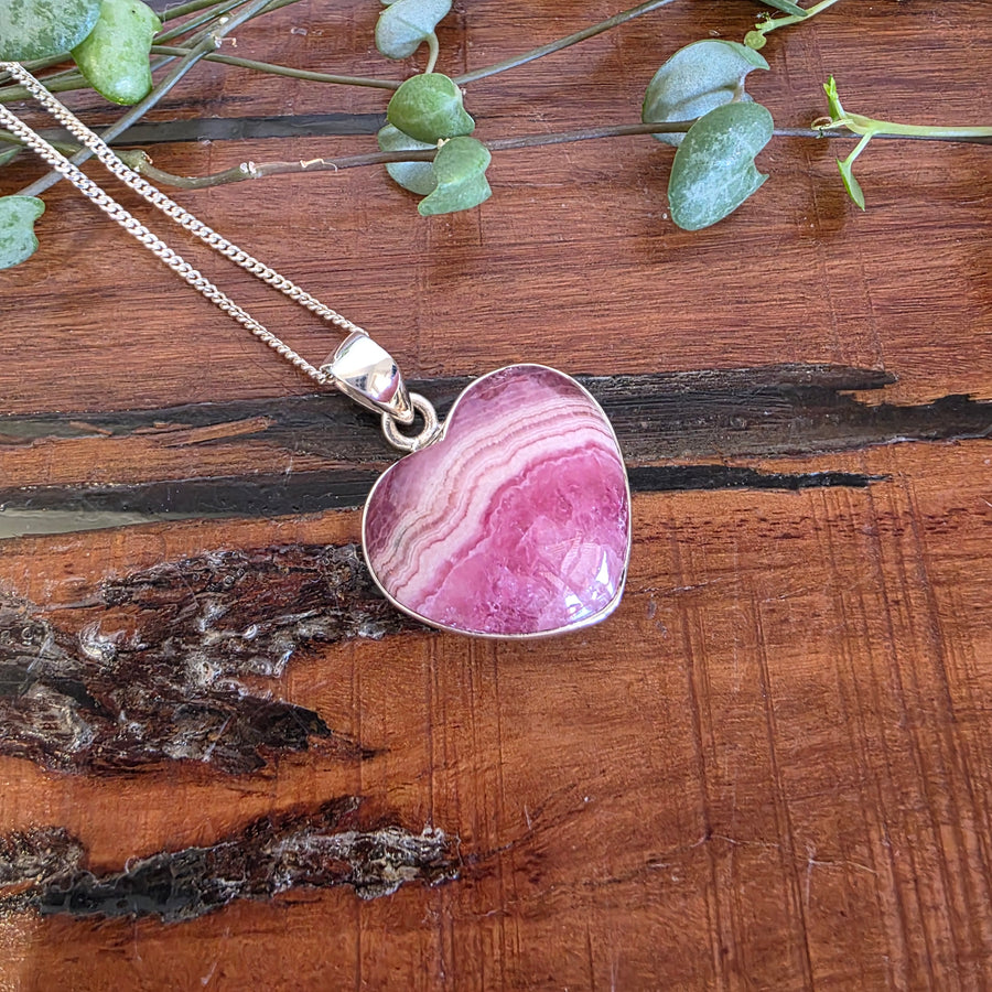 Rhodochrosite 21mm Heart Pendant.
Set in 925 Sterling Silver and comes with a 925 sterling silver chain.