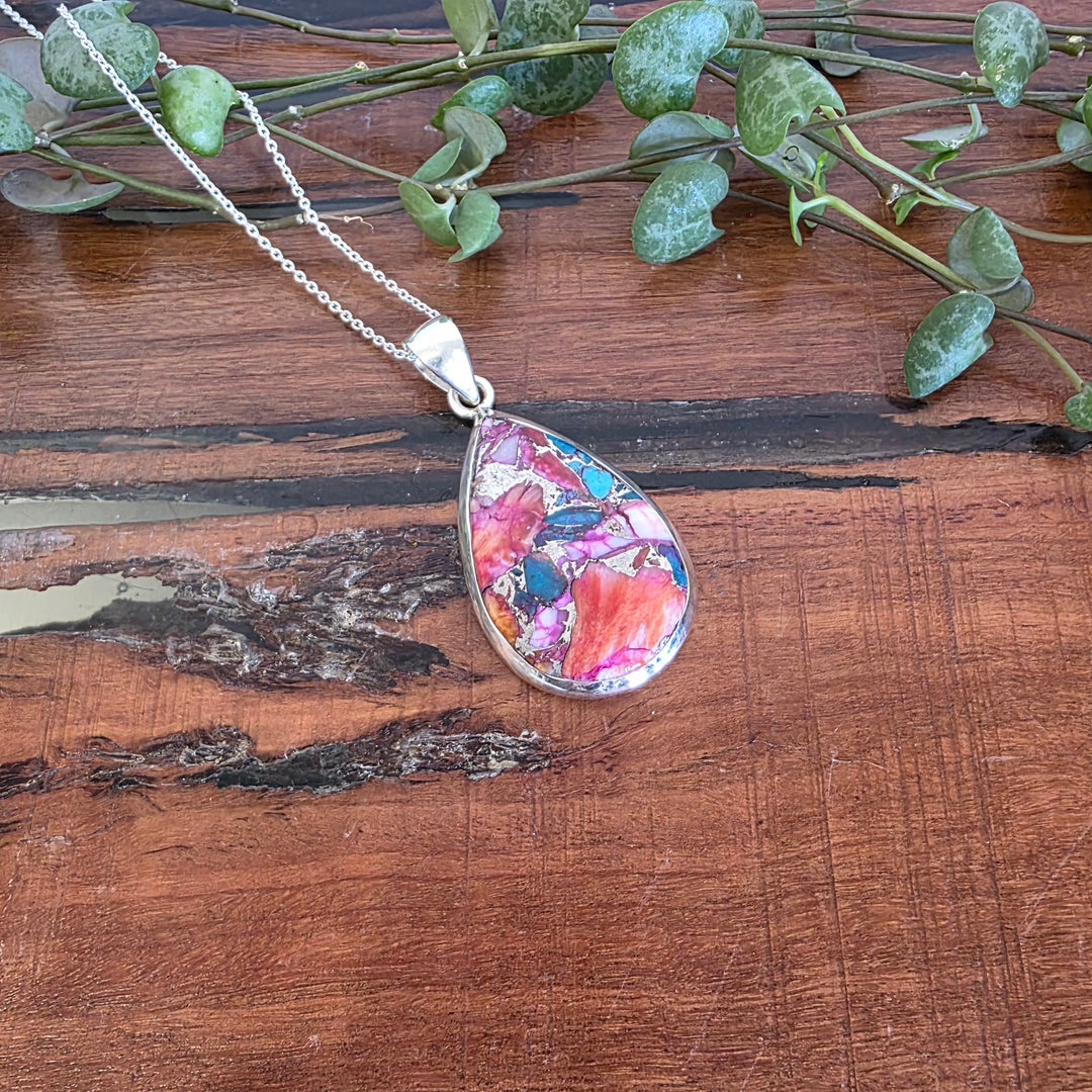 Pink Oyster Turquoise Pendant Set in 925 Sterling Silver.
Comes with a 45cm Sterling Silver Chain.