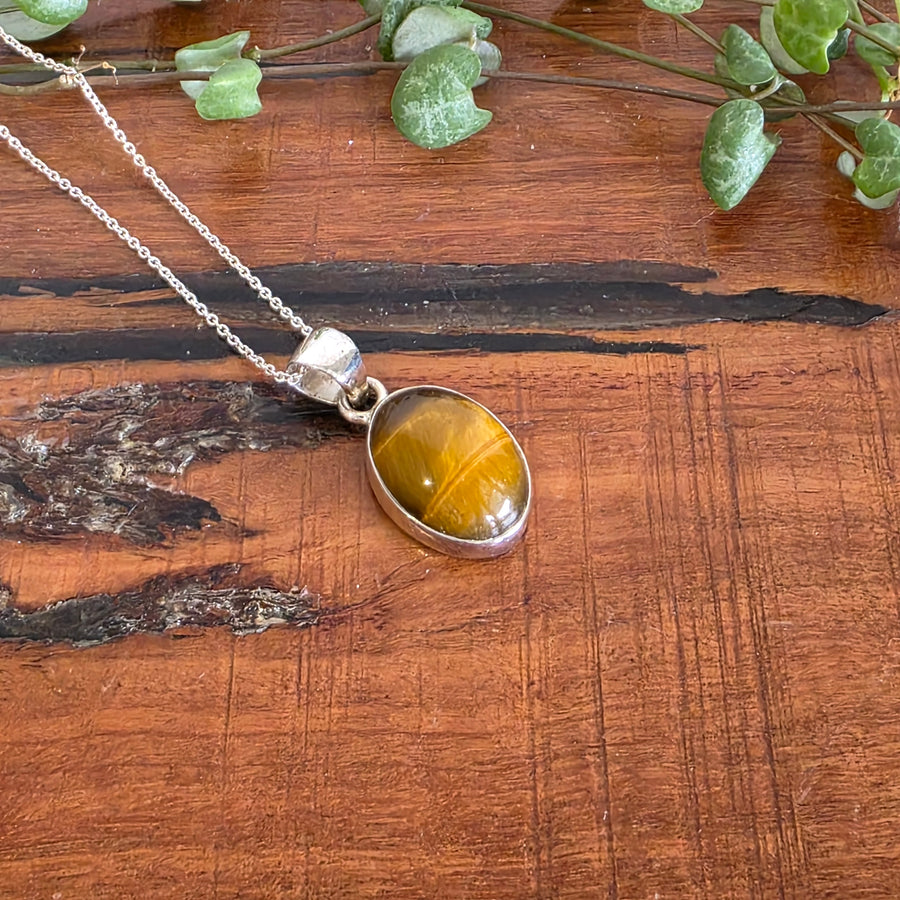 Tiger Eye Pendant set in 925 Sterling Silver, comes with a 925 Sterling Silver chain.