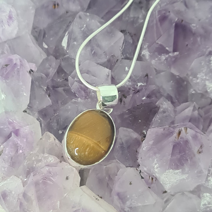 Tiger Eye Pendant set in 925 Sterling Silver, comes with a 925 Sterling Silver chain.